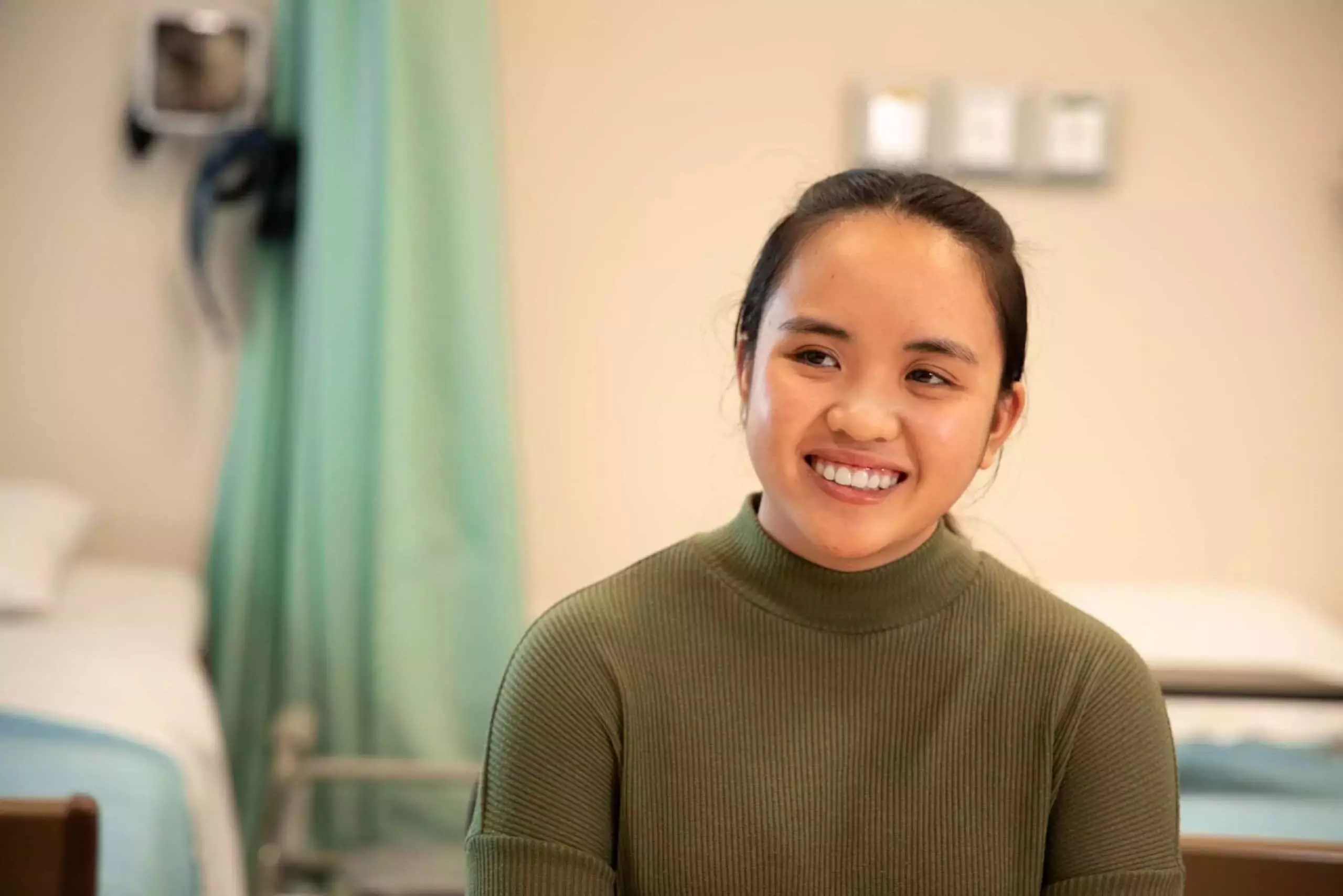Hannah smiling and enjoying her career as an HCA